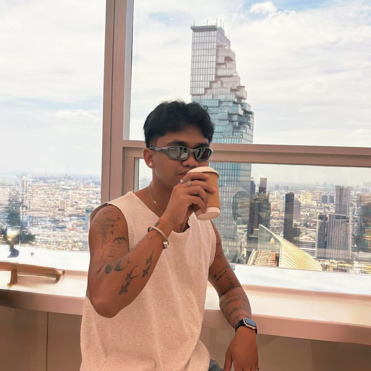 Josef Vito with a coffee by the window